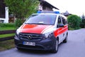 Modern white, Red ambulance emergency service vehicle, medics provide assistance, concept of emergency medical care, patient