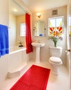 Modern white and red beautiful bathroom. Royalty Free Stock Photo