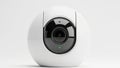 Modern white security camera with sleek oval lens and subtle green indicator light Royalty Free Stock Photo