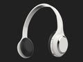 Modern white slim wireless headphones with silver details - low angle shot