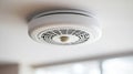 Modern White Smoke Alarm Installed on Ceiling, Ensuring Safety and Security in Bright Interior Royalty Free Stock Photo