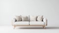 Modern white sofa with beige pillows in a minimalist studio, clean interior Royalty Free Stock Photo