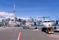 Modern white turboprop airliner with black six-bladed propellers sitting on the tarmac of Toronto City Airport separated Royalty Free Stock Photo