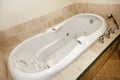 Modern white whirlpool bath tube Royalty Free Stock Photo