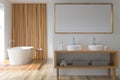 Modern white and wood look bathroom with oval ceramic bathtub Royalty Free Stock Photo