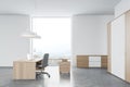 Modern white and wooden CEO office, side view Royalty Free Stock Photo