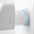 Modern Wi-Fi Extender Plugged into Wall Socket Royalty Free Stock Photo