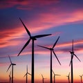 A modern wind turbine farm under a colorful sunset sky5