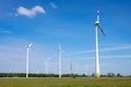 Modern wind turbines in an agricultural area