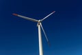 Modern Windmill Turbine on intense blue sky Royalty Free Stock Photo