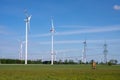 Modern windmills and a power line