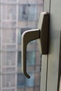 Modern Window Handle with Urban Background Royalty Free Stock Photo
