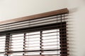 Modern window with stylish wooden blinds Royalty Free Stock Photo