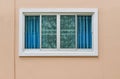 Modern windows with uv curtain and light brown house wall from outside view Royalty Free Stock Photo