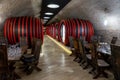 Modern wine cellar in Balatonlelle Hungary with huge wine barrels and wooden tables Royalty Free Stock Photo