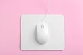 Modern wired mouse and white pad on background, top view Royalty Free Stock Photo