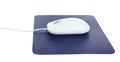 Modern wired optical mouse and blue pad isolated Royalty Free Stock Photo