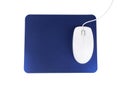 Modern wired optical mouse and blue pad on white, top view Royalty Free Stock Photo