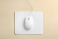 Modern wired optical mouse and pad on background, top view Royalty Free Stock Photo