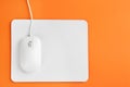 Modern wired optical mouse and pad on background, top view. Space for text Royalty Free Stock Photo