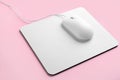 Modern wired optical mouse and pad on background Royalty Free Stock Photo