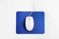 Modern wired optical mouse and pad on white background Royalty Free Stock Photo