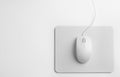 Modern wired optical mouse and pad on background, top view Royalty Free Stock Photo