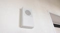 Modern wireless electronic door bell for two-tone tone, close-up. White wall bell.