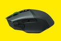 Modern wireless gaming computer mouse isolated on yellow background Royalty Free Stock Photo