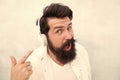 Modern wireless headphones. Electronic dance music tracks. Instrumental music. Bearded man headphones. Enjoy every note