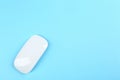 Modern wireless optical mouse on blue background, top view. Space for text Royalty Free Stock Photo