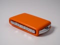 Modern wireless orange car ignition key on a white background. Royalty Free Stock Photo