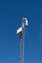 Modern wireless telecommunication tower antenna transmitter or base reciever station for broadcasting 4G or 5G cellular telephone Royalty Free Stock Photo
