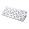 Modern wireless white keyboard angled on a white background ready for office use Royalty Free Stock Photo