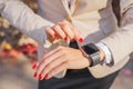 Modern woman checking time on her smartwatch