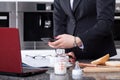 Modern woman preparing meal for child and working at morning