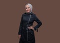 Modern woman wearing hijab posing on plain background with smiling Royalty Free Stock Photo