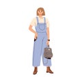 Modern woman wearing summer fashion clothes. Trendy casual outfit with loose denim overalls, t-shirt, laced boots and