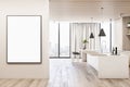 Modern wood and concrete kitchen interior with empty poster on wall, island, appliances and window with city view and daylight. Royalty Free Stock Photo