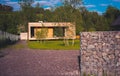 Modern wood house with patio and functional outdoor furniture with garden. Royalty Free Stock Photo