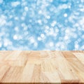 Modern wood table with blue blurry background