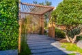 Modern wooden arbor. Modern wooden roofing in courtyard, backyard, terrace or patio