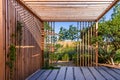 Modern wooden arbor. Modern wooden roofing in courtyard, backyard, terrace or patio