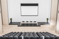 Modern wooden auditorium interior with empty banner, seatings and daylight. Workshop concept.