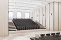 Modern wooden auditorium interior with seatings, city view and daylight.