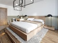 A modern wooden bed on a two-stage wooden catwalk with lighting, a bedroom in a loft style Royalty Free Stock Photo