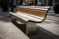 Modern wooden benches standing on the sides of the paved paths of the city park on a rainy day Royalty Free Stock Photo