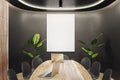 Modern wooden and black meeting room interior with empty white mock up banner, equipment, furniture and decorative plants.