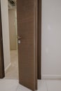 Modern wooden brown door with metal door handle Royalty Free Stock Photo