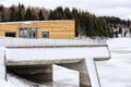 Modern wooden building on the concrete bridge